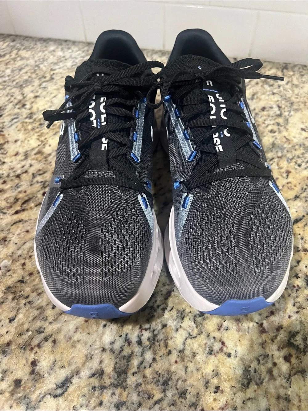 On Running Men's/Women's Trainer in Black and Gray with White Sole